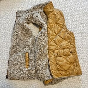 Reversible puffer vest with faux shearling lining